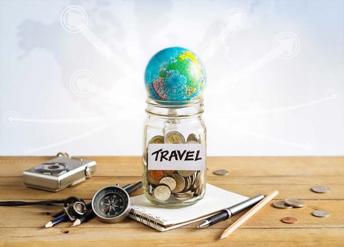 Travel cheap savings jar money glass map background world concept stock